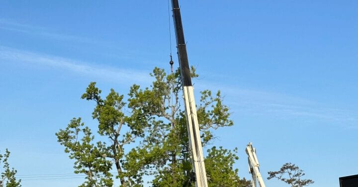 Crane operating near the Outer Banks coast with a clear sky