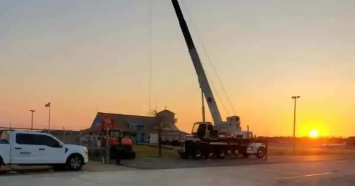 Crane operator placing shed in residential property Kitty Hawk